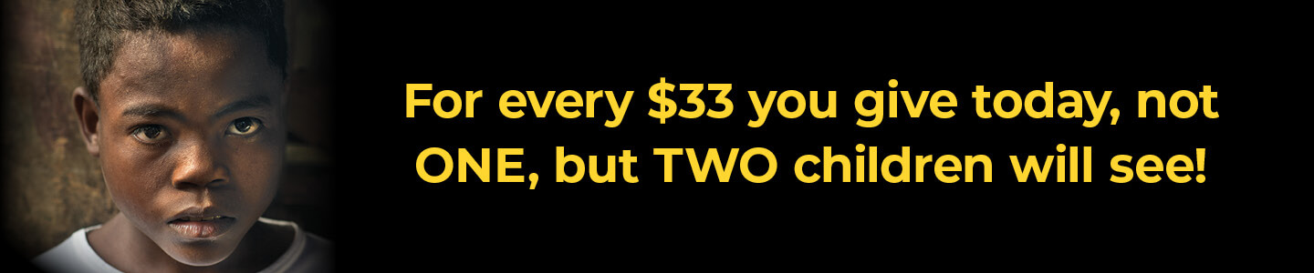 Oscar looking at the camera with the caption 'For every $33 you give today, not ONE, but TWO children will see!'