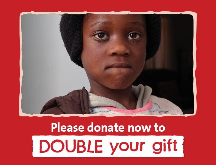 Text reads “Please donate now to double your gift”. On the right side, Camille looking at camera solemnly is visible.