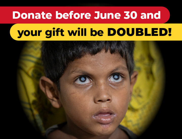 Oscar looking at the camera with the caption 'Umar looking at the camera with the caption 'Donate before June 30 and your gift will be DOUBLED!'